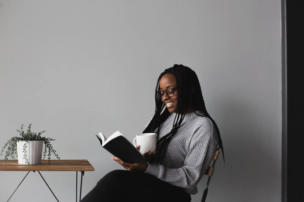 Woman reading one of the top marketing books