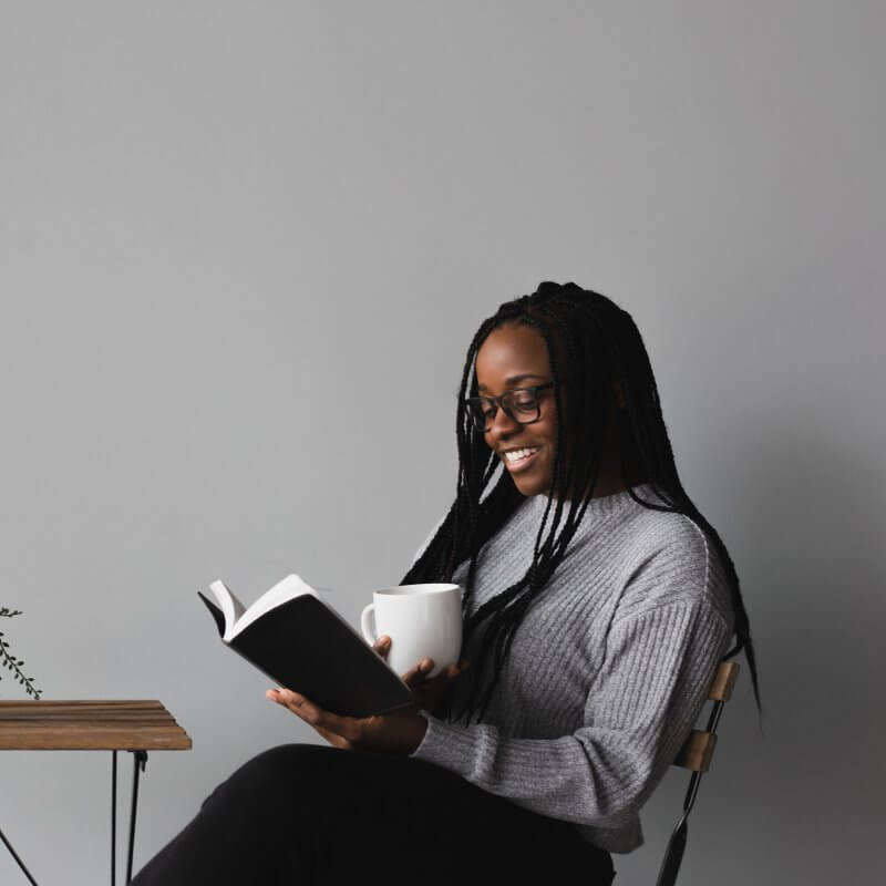 Woman reading one of the top marketing books