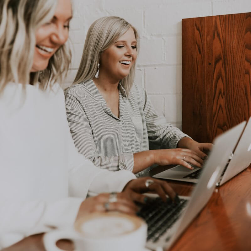 Two girls on their computers