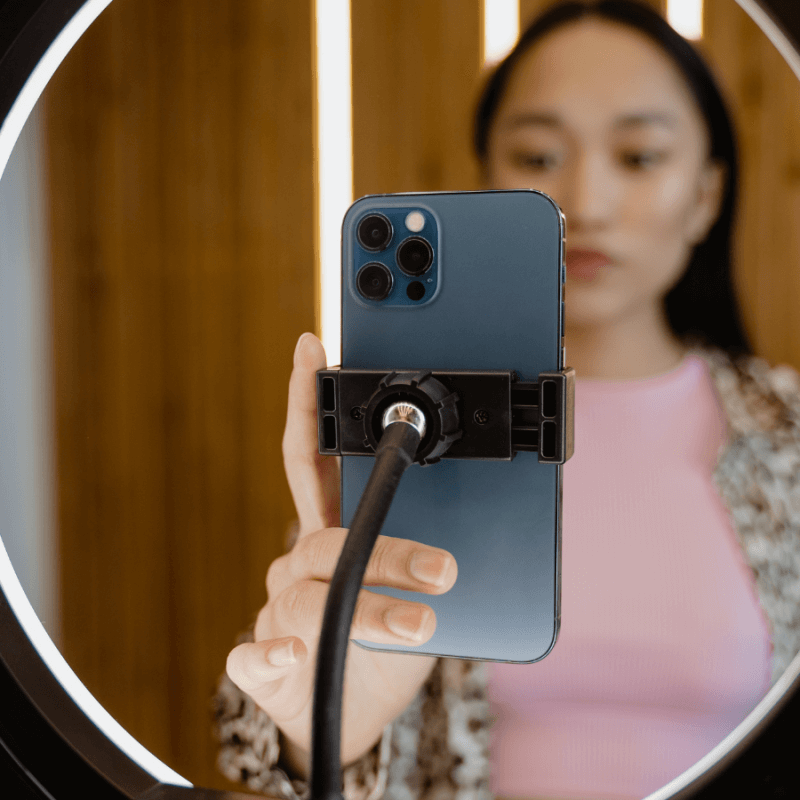 Girl filming a TikTok video