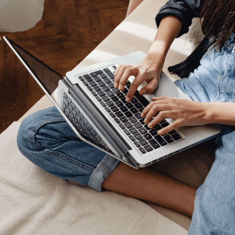 A woman typing on her keyboard | Stop Losing Website Traffic