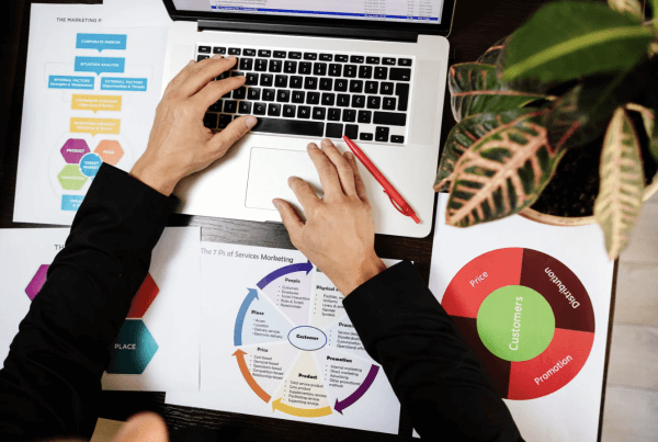 A person working with graph and charts | How to Use Q4 Data to Plan a Strong 2026 Marketing Strategy